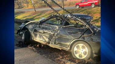 Driver cited after car crashes into Newton brook