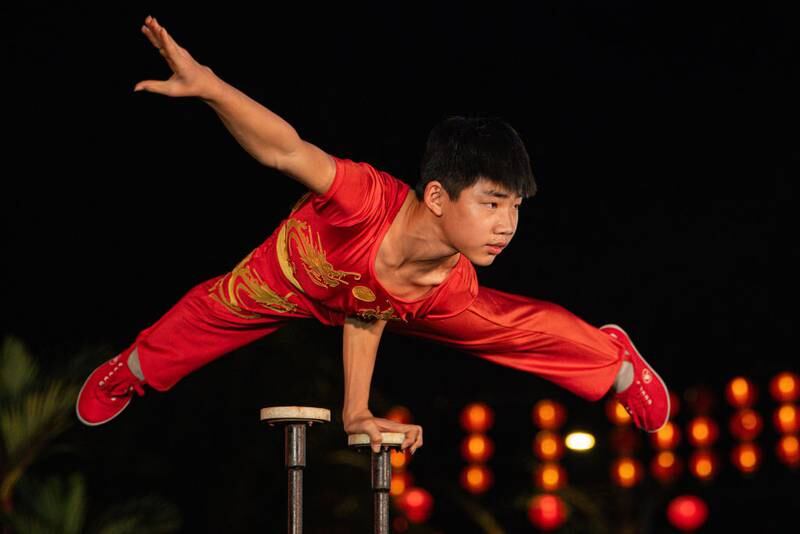 KUALA LUMPUR, MALAYSIA - FEBRUARY 10: A member of a China Acrobatics troupe performs during the Lunar New Year celebration at Thean Hou Temple on February 10, 2024, in Kuala Lumpur, Malaysia. Chinese New Year in Malaysia is marked by family gatherings, festive adornments and traditional rituals embodying a spirit of hope and renewal for the year ahead, and aims to bring joy and prosperity to all while fostering a sense of unity and hope for a successful Year of the Dragon. (Photo by Annice Lyn/Getty Images)