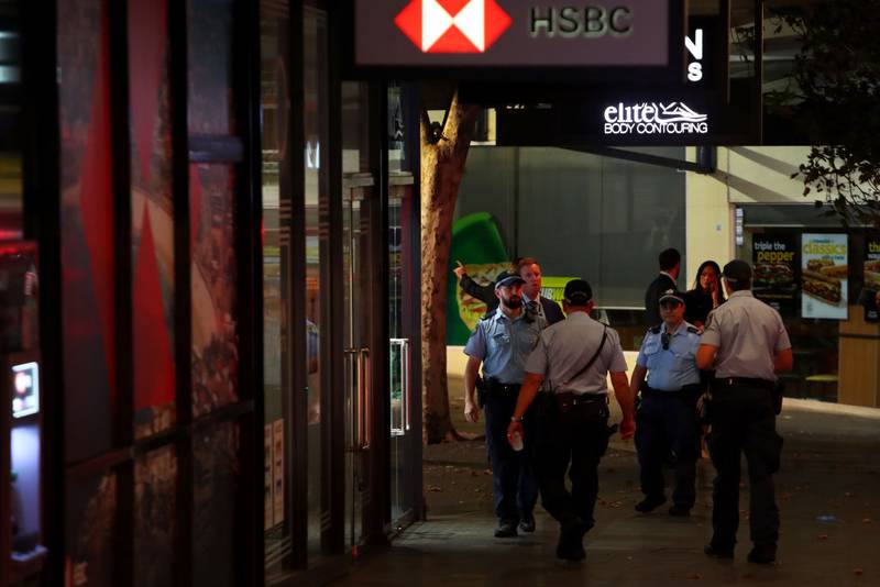 BONDI JUNCTION, AUSTRALIA - APRIL 13: NSW police and shopping centre staff are seen outside Westfield Bondi Junction on April 13, 2024 in Bondi Junction, Australia. Six victims, plus the offender, are confirmed dead following an incident at Westfield Shopping Centre in Bondi Junction, Sydney. (Photo by Lisa Maree Williams/Getty Images)