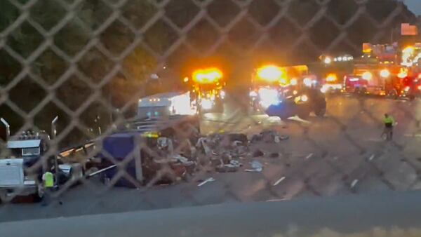 Traffic brought to standstill after tractor-trailer hauling junk crashes on I-93 in Wilmington