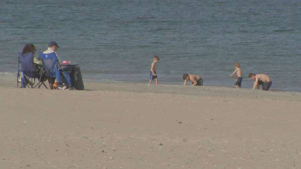 Beach day in April? People warned not to go in water due to cold temperatures, no lifeguards