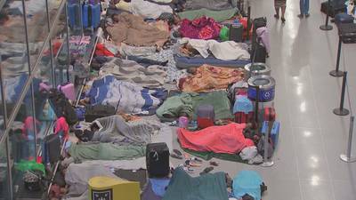 Photos: Families sleeping at Logan Airport