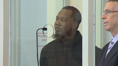 Avery Lewis, the suspect in the shooting of a Boston Police officer, appears in court for his arraignment