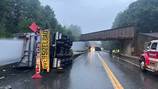 Tractor-trailer hauling windmill blade overturns after striking bridge on New England highway