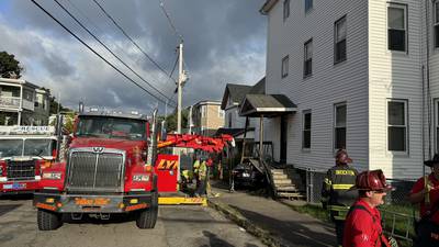 Driver hospitalized after car hits home in Brockton 