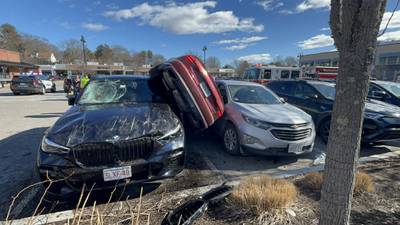 Photos: Crash in Wellesley grocery store parking lot leaves Audi wedged between 2 vehicles 