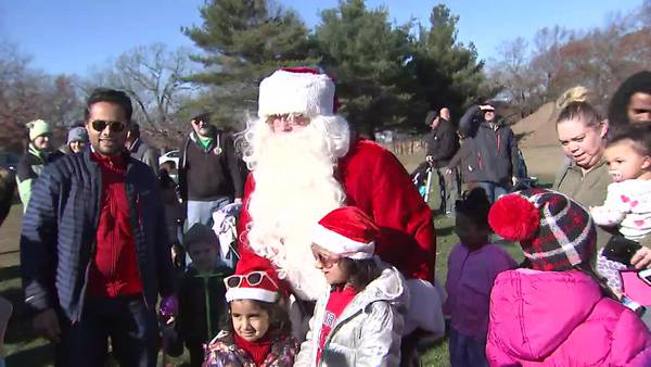 Arriving in style: Santa comes to town in a helicopter 