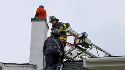 ‘Not what you see every day’: 10-year-old boy rescued after being stuck in chimney of Whitman home