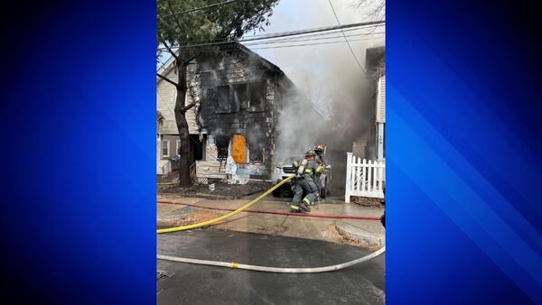 Crews working to extinguish fire that spread to multiple buildings in Lynn