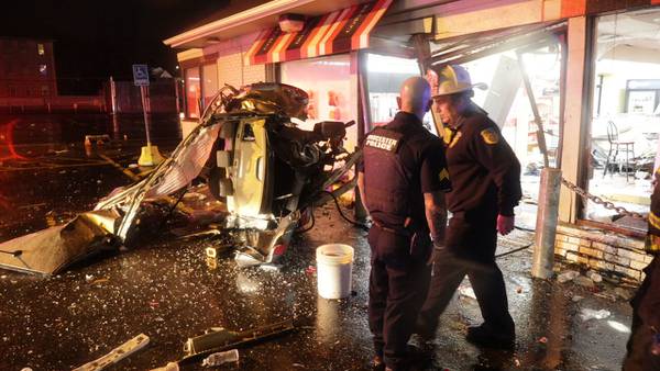 Car split in half after driver smashes through Honey Dew Donuts shop