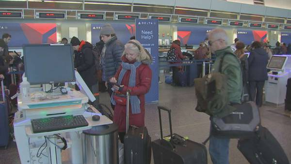 Holiday travelers lining up at Logan Airport trying to get out before the storm