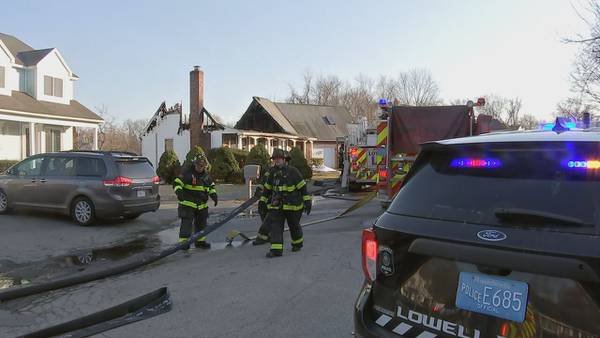 Fire rips through roof of Lowell home