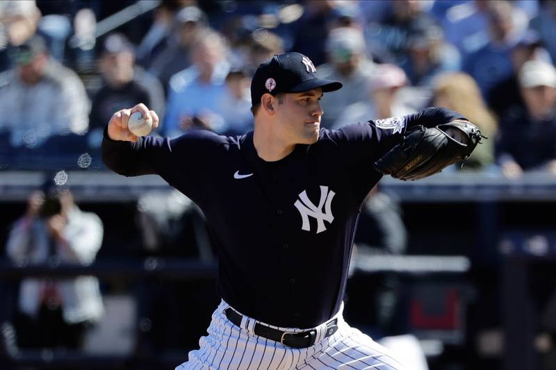 In this Feb. 29, 2020, file photo, New York Yankees' Adam Ottavino delivers a pitch during the fifth inning of a spring training baseball game against the Detroit Tigers in Tampa, Fla.