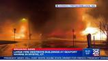 Massive fire tears through Mystic Seaport Marine