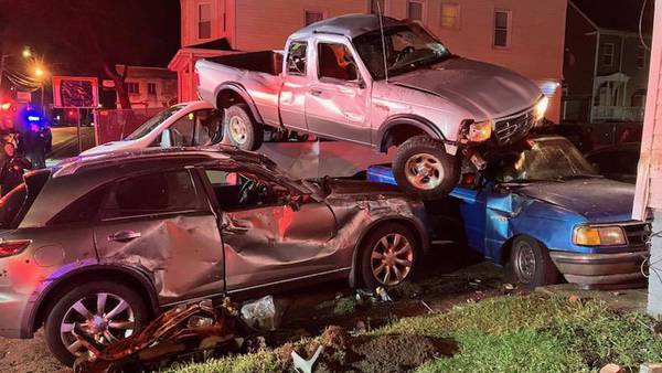 Truck goes airborne, lands on top of several vehicles after striking building in Brockton
