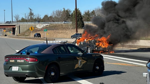 Truck crashes into a toll booth on I-95 north in Hampton, New Hampshire and catches fire