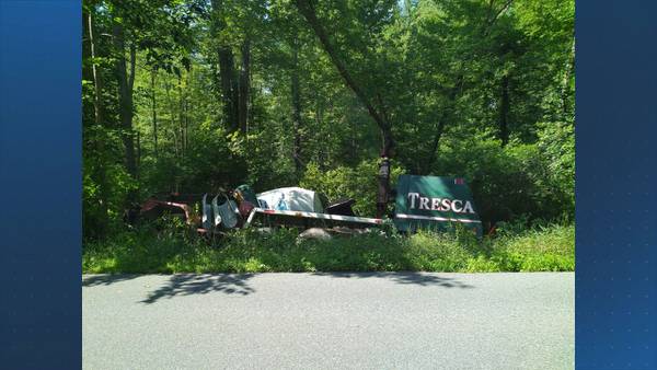 Driver entrapped after cement truck rolls off the road in Holliston