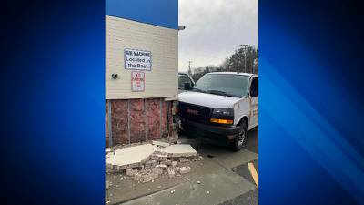 Van collides into Stoughton gas station after tractor trailer rollover