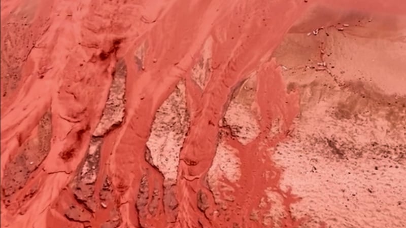 Rain creates a crimson spectacle on Iran's Hormuz Island for the first time this year