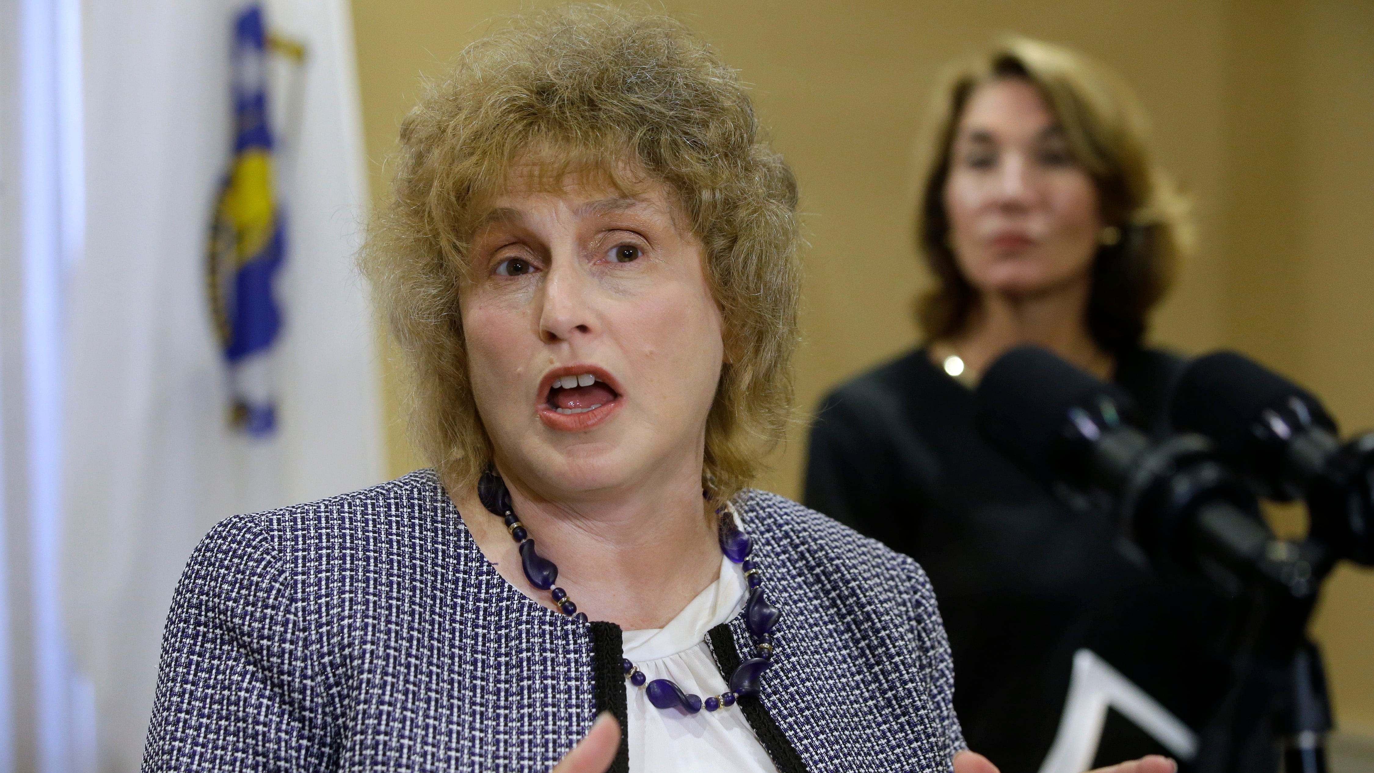 Massachusetts Transportation Secretary Stephanie Pollack, left, and Mass. Lt. Gov. Karyn Polito, right, face reporters during a 2019 news conference, at the Statehouse in Boston.