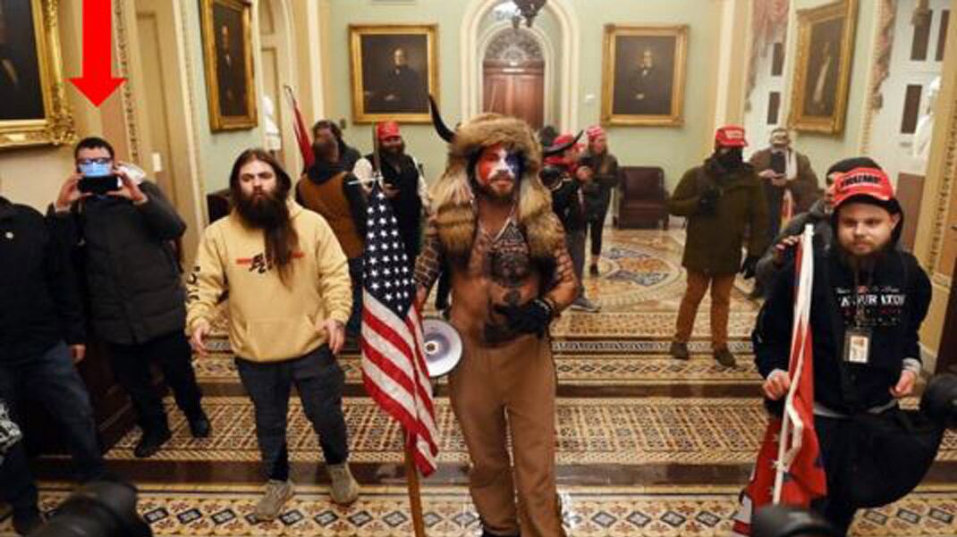 Brian McCreary, 33, of North Adams, was arrested Thursday by the FBI. Prosecutors say McCreary entered the Capitol building and was captured in photos near a shirtless Arizona man with face paint and a hat with horns.