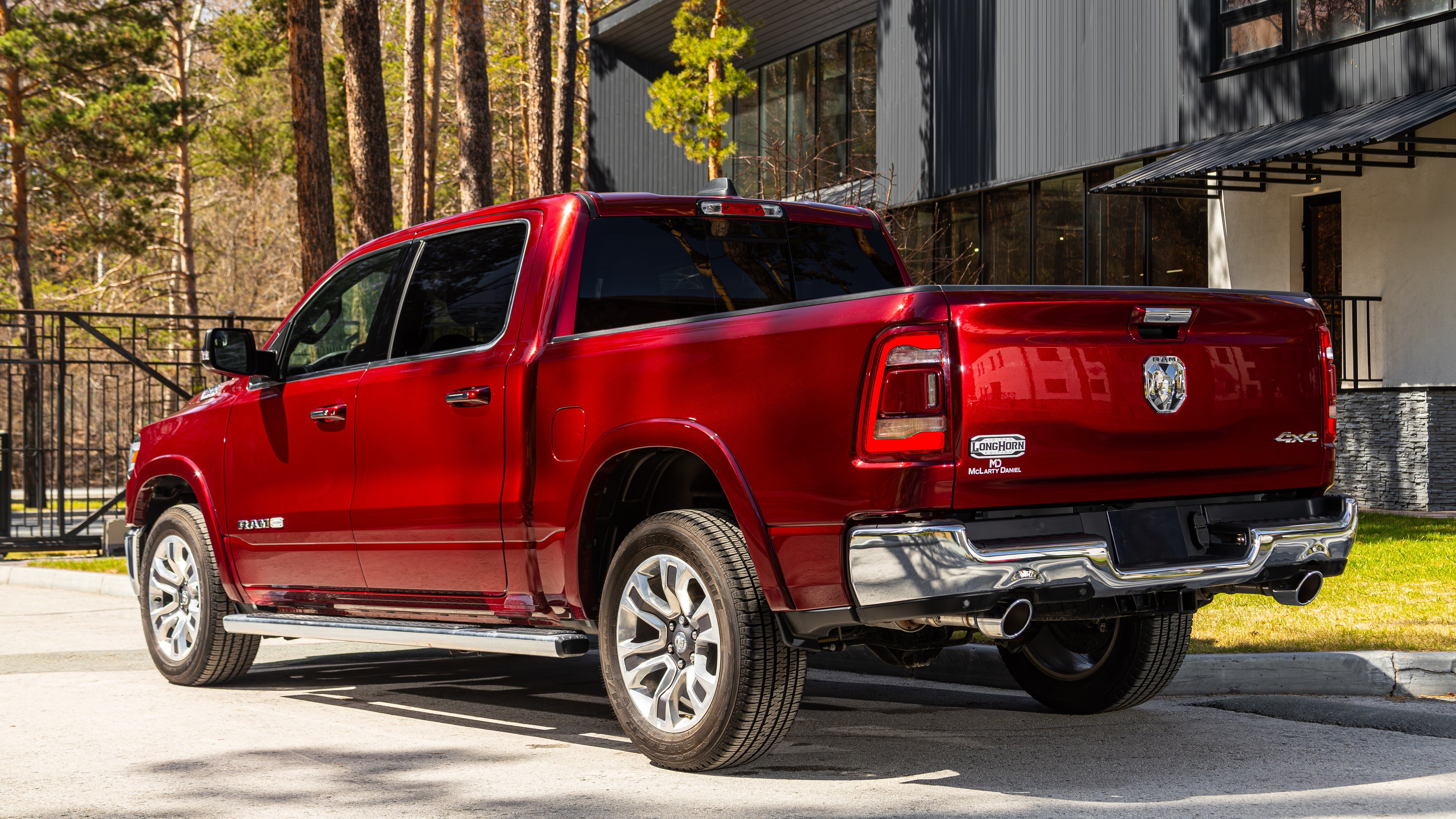 red Dodge Ram 1500 LongHorn, pickup parked in park, back view