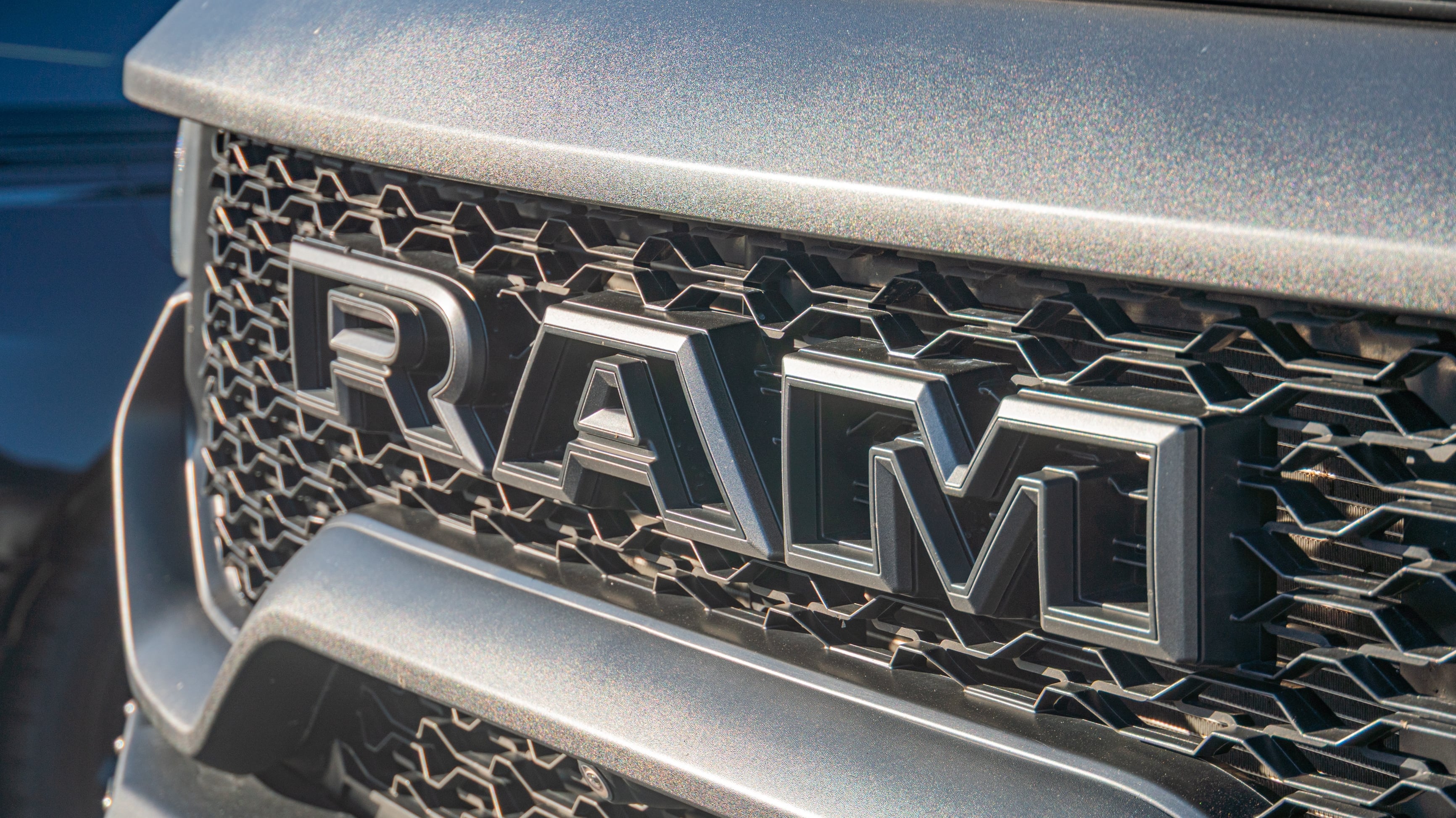 Close-up view of Ram truck grille, distinctive grid pattern