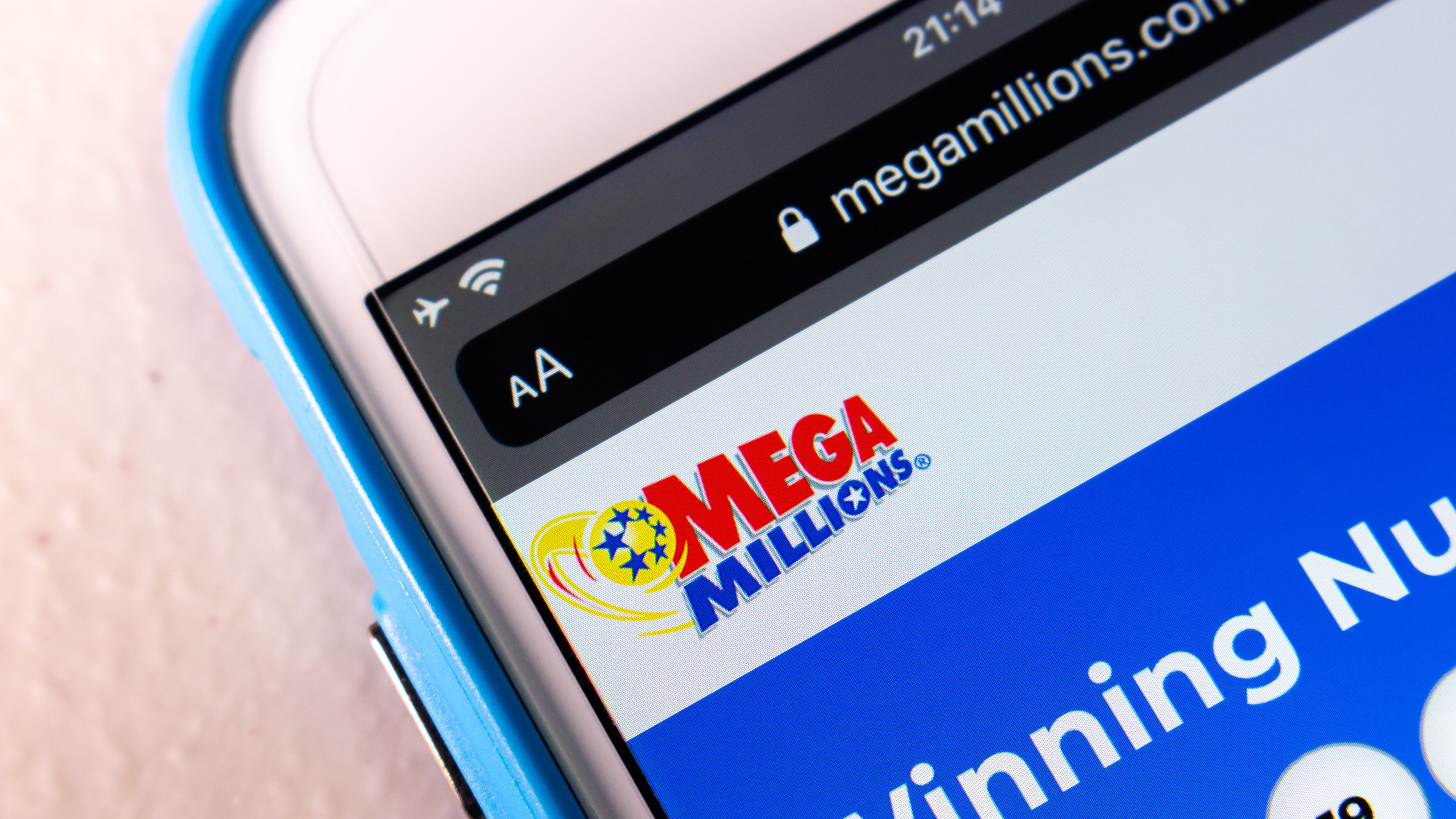 Closeup logo of Mega Millions on its website on iPhone.