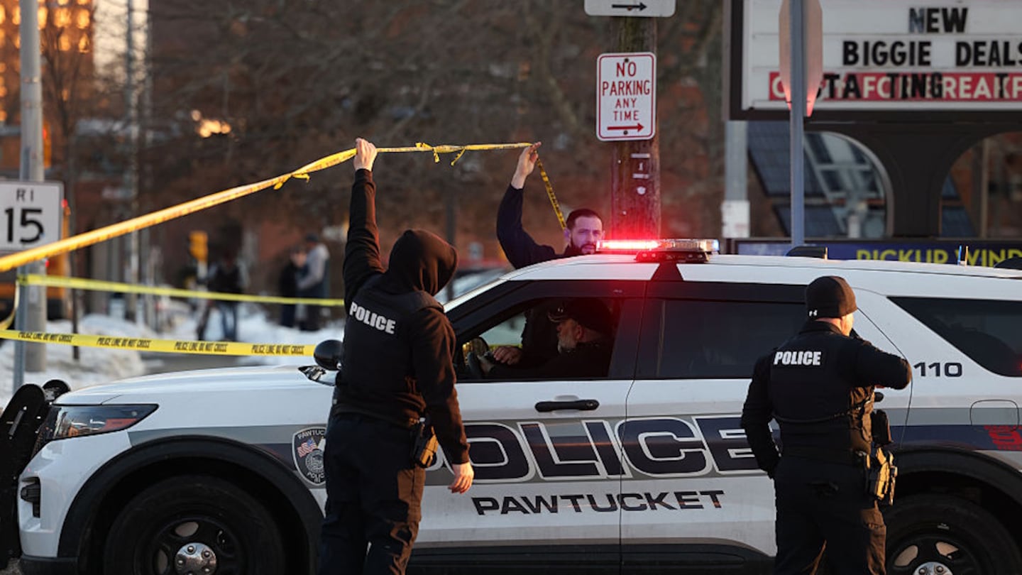 Police secure the area after a shooting at an ice arena on Monday.