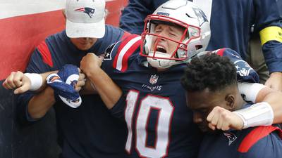 Patriots QB Mac Jones hops off field in pain after suffering leg injury in loss to Ravens
