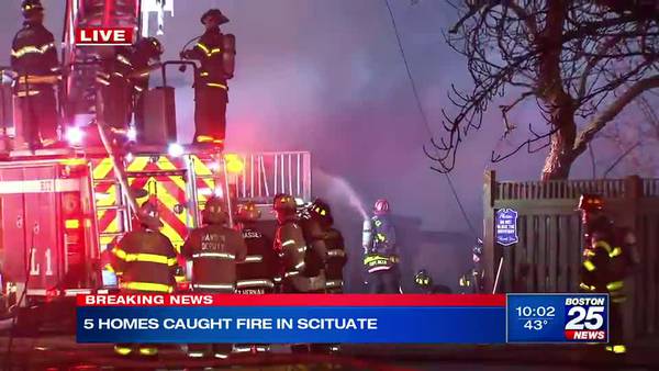 Crews battling a massive blaze that has engulfed several buildings along Scituate coast