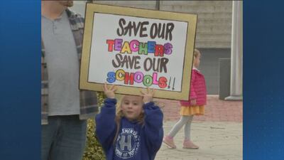 Dozens rally outside Braintree Town Hall against likely school cuts 
